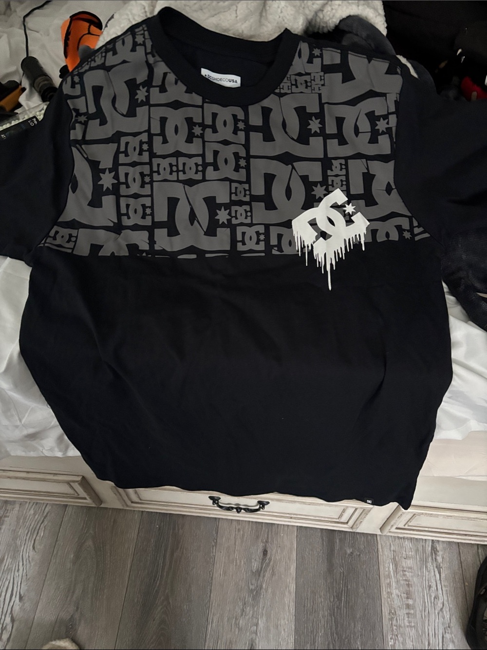 DC Black Short-Sleeve Tee with Gray Logo Pattern and White Drip Emblem
